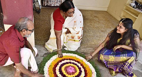 A family drawing pookolam on the eve of Onam (File photo | P Jawahar, EPS)