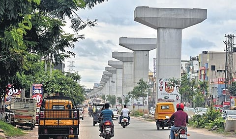 Motorists pass by the Uppal elevated corridor flyover which is under construction  since 2018 | S Senbagapandiyan