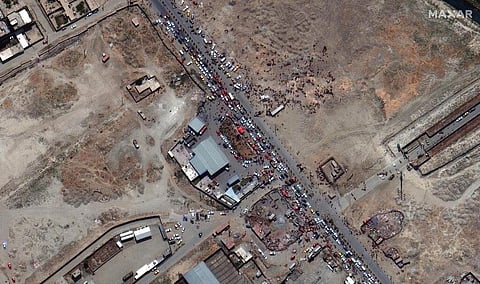 In this satellite photo released by Maxar Technologies, a crowd outside of Kabul's international airport is seen amid evacuations on Monday, Aug. 23, 2021. (Photo | AP)