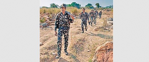 Police personnel undertake combing operations in a Maoist-hit village along the Telangana-Chhattisgarh border