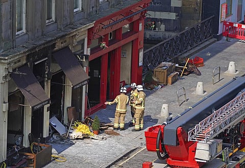 Firefighters at the scene after a fire at the Elephant House Cafe in Edinburgh, Wednesday, Aug. 25, 2021. (Photo | AP)