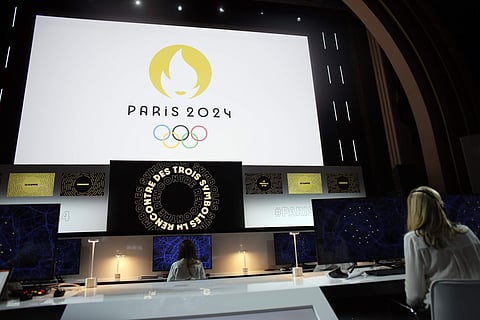 Paris 2024 Olympic logo is displayed on a screen during a ceremony, in Paris. 