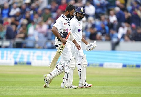 Cheteshwar Pujara (L) and Rohit Sharma walk off the field at tea during the third day of third test cricket match between England and India, at Headingley, Leeds, England, Aug 27, 2021. (Photo | AP)