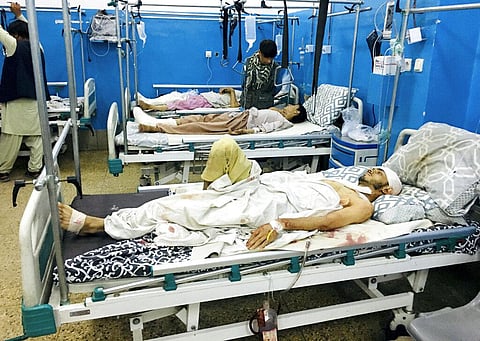 Wounded people lie on beds at a hospital after a deadly attack outside the airport in Kabul, Afghanistan. (Photo | AP)