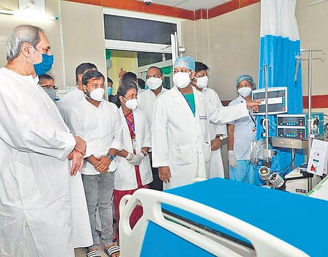 Chief Minister inspecting the ECMO unit at SCB MCH in Cuttack on Friday | Express