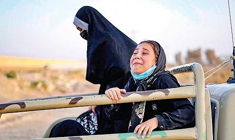Afghan women on the back of a truck at the Afghanistan-Iran border.