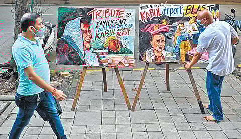 Street art in Mumbai condemning the twin blasts at Kabul airport (Photo | PTI)