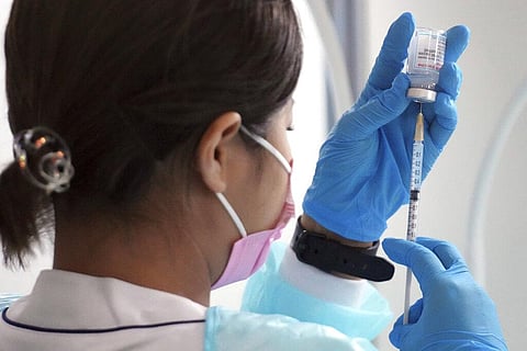 A health worker prepare a dose of the Moderna COVID-19 vaccine at Sumida ward of Tokyo (Photo | AP)