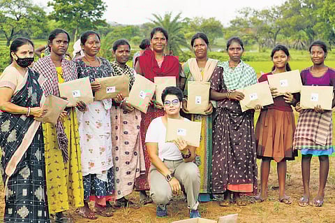 Anushree Dash (centre) with beneficiaries of her campaign. (Photo | EPS)