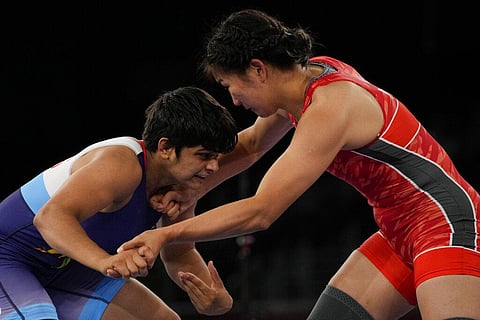 India's Sonam Sonam, left, and Mongolia's Battsetseg Soronzonbold compete during the men's kg Greco-Roman wrestling match. (Photo | AP)
