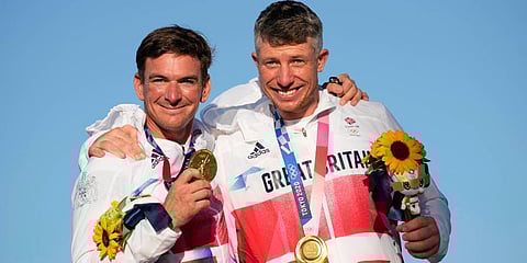 First placed Britain's Stuart Bithell and Dylan Fletcher celebrate at the end of the men's 49er medal race during the 2020 Summer Olympics in Fujisawa, Japan. (Photo | AP)