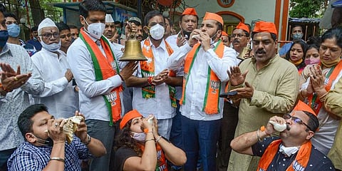 BJP activists blow conches during their agitation demanding reopening of temples for public, outside the Ghantali Devi temple in Thane on Monday. (Photo | PTI)