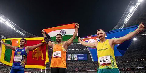 India's gold medalist Sumit Antil (C) pose for the cameras after the Men's Javelin Throw F44 during the Tokyo 2020 Paralympic Games in Tokyo. (Photo | AP)