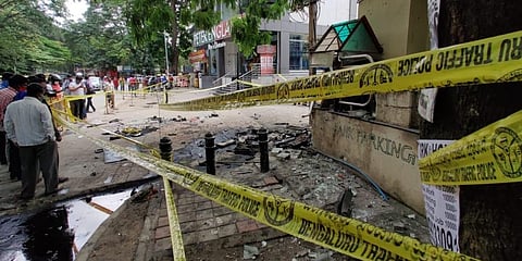 Crowd gathers in Koramangala where a speeding Audi Q3 car crashed into a footpath on Tuesday. (Photo | Ashish Krishna, EPS)