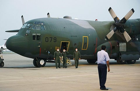 Japan Air Self-Defense Force airmen get off their C-130 cargo plane upon arrival at Islamabad International Airport in Islamabad, Pakistan, en route to Kabul, Afghanistan. (Photo | AP)