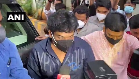 Telugu film director Puri Jagannadh arrives at the ED office in Hyderabad to appear before the agency officials in connection with a drugs case. (Photo | ANI)