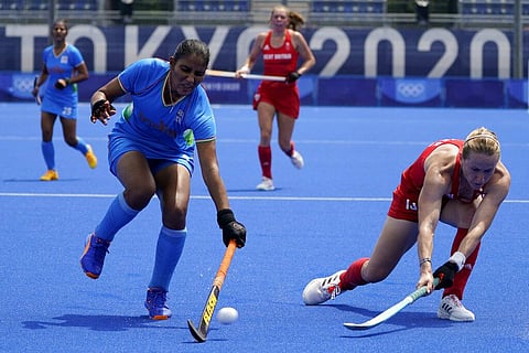 India's Gurjit Kaur (2) blocks a shot by Britain's Elena Sian Rayer (13) during a women's field hockey match at the 2020 Summer Olympics. (Photo | AP)