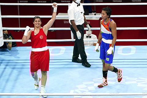 Busenaz Surmeneli, of Turkey, left, reacts after defeating Lovlina Borgohain, of India, right, in their women's welter weight 64-69kg semifinal boxing match. (Photo | AP)