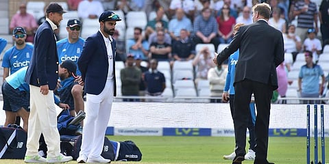 India's captain Virat Kohli (C) and England captain Joe Root (L) at the toss prior to the start on first day of the first Test cricket match, at Trent Bridge in Nottingham. (Photo | AP)