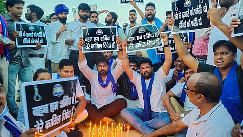 Bhim Army activists during a candle march after a minor girl was allegedly raped and murdered, near India Gate in New Delhi, Wednesday, Aug 4, 2021. (Photo | PTI)