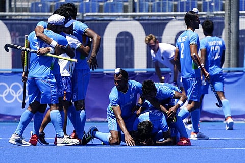India players celebrate after defeating Germany 5-4 during the men's field hockey bronze medal match at the 2020 Summer Olympics. (Photo | AP)