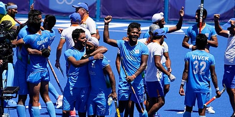 Indian players celebrate after defeating Germany 5-4 during the men's field hockey bronze medal match at the 2020 Summer Olympics in Tokyo, Japan. (Photo | AP)