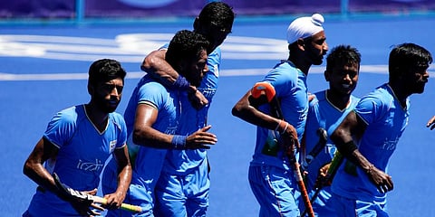 India players react after Harmanpreet Singh, second from left, scored on Germany during the men's field hockey bronze medal match at the 2020 Summer Olympics in Tokyo, Japan. (Photo | AP)