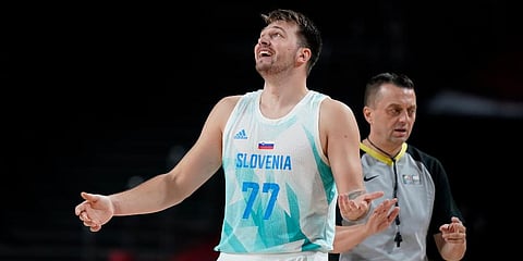 Slovenia's Luka Doncic (77) reacts to a foul call during men's basketball quarterfinal game against Germany at the 2020 Summer Olympics in Saitama, Japan. (Photo | AP)