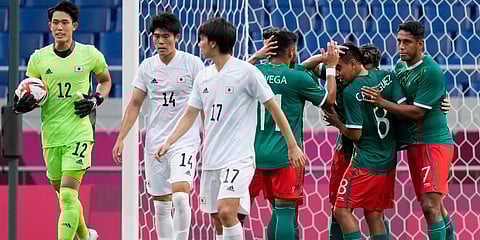 Mexico players celebrate after Sebastian Cordova scored from the penalty spot the opening goal in the men's bronze medal soccer match against Japan at the 2020 Summer Olympics in Saitama. (Photo | AP)