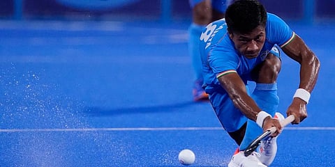 India's Nilakanta Sharma (18) passes against Japan during a men's field hockey match at the 2020 Summer Olympics in Tokyo, Japan. (Photo | AP)