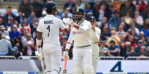India's Ravindra Jadeja (R) fist bumps with batting partner KL Rahul to celebrate scoring runs during the third day of first test cricket match. (Photo | AP)