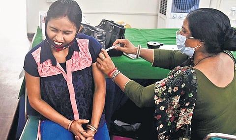 A beneficiary gets the first dose of COVID-19 jab at a vaccination centre in Delhi. (Photo| Parveen Negi, EPS)