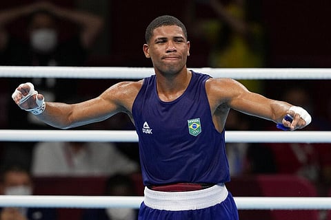 Brazil's Hebert Sousa celebrates winning his men's middleweight 75-kg boxing gold medal match against Ukraine's Oleksandr Khyzhniak. (Photo | AP)