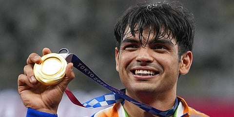 Gold medalist Neeraj Chopra, of India, poses during the medal ceremony for the men's javelin throw at the 2020 Summer Olympics. (Photo | AP)