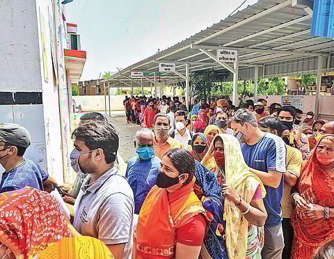 Beneficiaries line up to receive Covid-19 vaccine doses in Jaipur (File Photo | PTI)