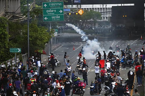 Riot police launch tear gas to anti-government protesters during a protest in Bangkok, Thailand. (Photo | AP)