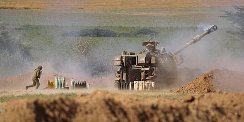 An Israeli artillery unit fires toward targets in the Gaza Strip, at the Israel-Gaza border. (File photo | AP)