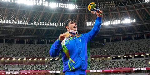 Gold medalist Neeraj Chopra, of India, poses during the medal ceremony for the men's javelin throw at the 2020 Summer Olympics. (Photo | AP)