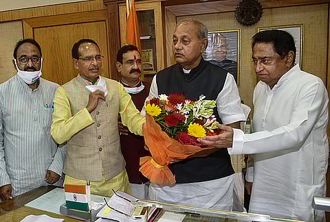 Madhya Pradesh State Assembly speaker Girish Gautam being greeted by CM Shivraj Singh Chouhan and LoP Kamal Nath as former Speaker NP Prajapati (L) looks on, during all-party meeting. (Photo | PTI)