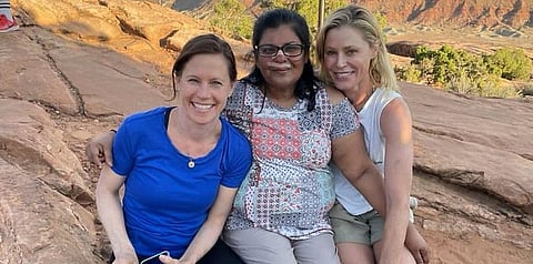 In this Tuesday, Aug. 3, 2021, photo provided by Shaji John, John's wife, Minnie John, center, poses with actress Julie Bowen, right, and Bowen's sister, Dr. Annie Luetkemeyer, left. (Photo | AP)