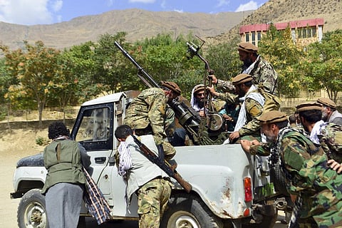 Militiamen loyal to Ahmad Massoud, son of the late Ahmad Shah Massoud, push a vehicle during a training exercise, in Panjshir province, northeastern Afghanistan. (Photo | AP)
