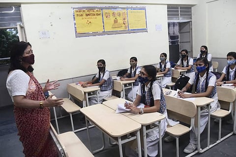 Students of class 12th seen attending classes after the reopening of schools in New Delhi, on Wednesday. (Photo | Parveen Negi/EPS)