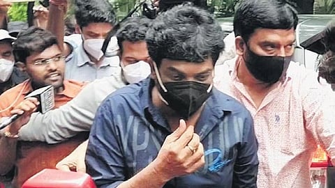 Tollywood director Puri Jagannath appears before the ED for questioning, in connection with the drug trafficking case, in Hyderabad.
