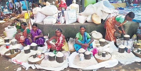 Tribal women selling ‘chuda’ made from newly-harvested rice in Chandahandi market (Photo | Express)