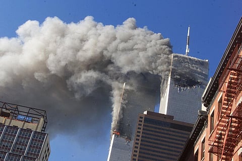 Smoke rises from the burning twin towers of the World Trade Center after hijacked planes crashed into the towers on September 11, 2001 in New York City. (Photo | AP)