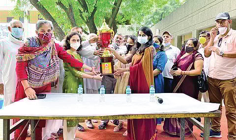 Representatives of Tatesar village receive the trophy for emerging winner in Corona Mukt Gaon Abhiyan contest | express