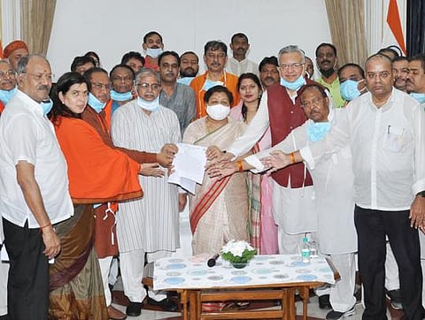 Senior BJP leaders submitting memorandum to Governor Anusuiya Uike against alleged religious conversions in the state. (Photo | EPS)