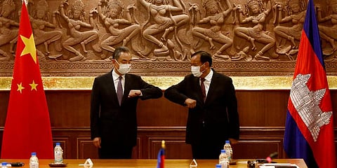 Chinese Foreign Minister Wang Yi, left, greets with Cambodian counterpart Prak Sokhonn in Phnom Penh, Cambodia, Sunday, Sept. 12, 2021. (Photo | AP)