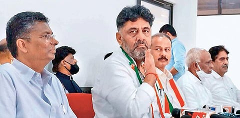 KPCC president DK Shivakumar addresses the media in Belagavi on Sunday.  KPCC working president Satish Jarkiholi looks on | Express