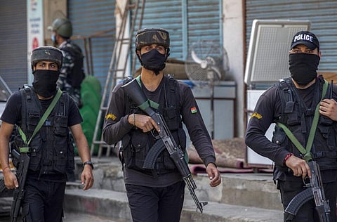Jammu and Kashmir police Special Operations Group (SOG) personnel arrive near the site of a shootout in Srinagar. (Photo | AP)